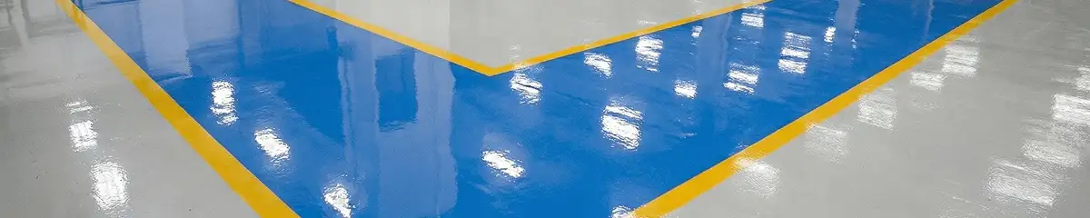 A factory floor professionally covered and marked with epoxy flooring in Miami, FL