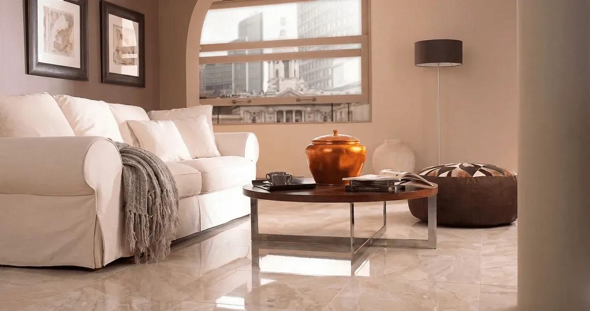 Modern living room with professionally installed marble flooring, a beige sofa, coffee table in Miami, FL
