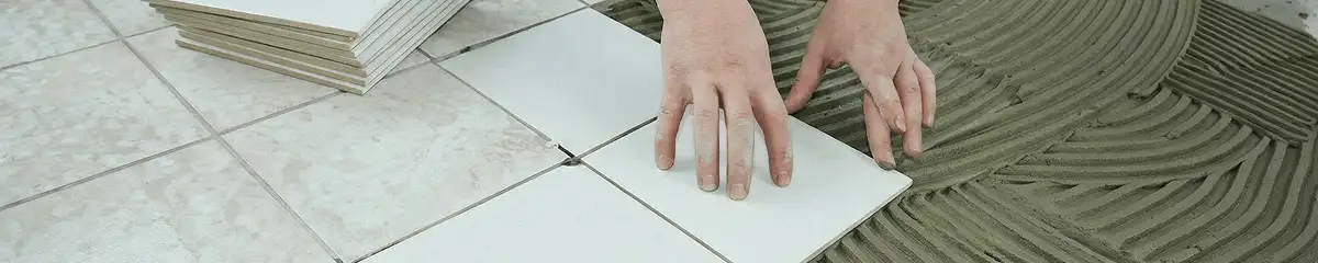Professional installing white tile floors in Miami, FL