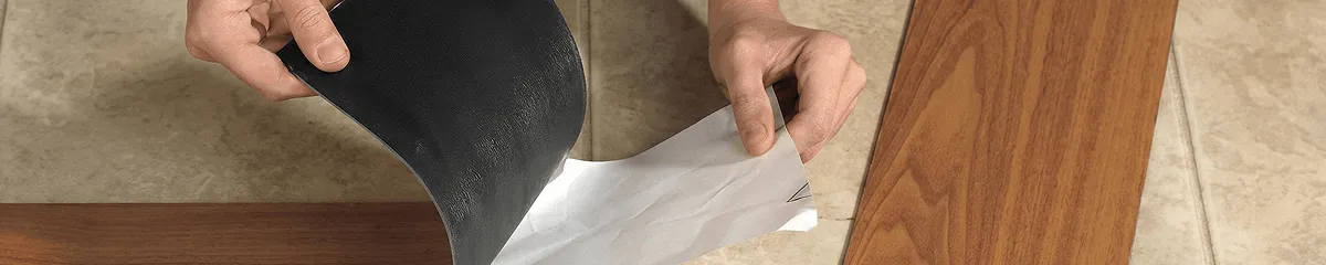 A professional installing vinyl flooring in Miami, FL